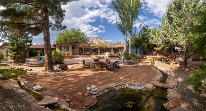 The residential exterior of Aeterna Health with a landscaped garden and water feature